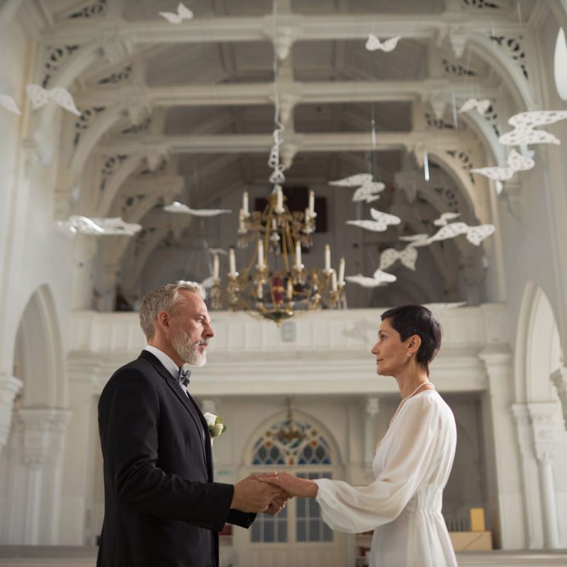 wide-angle-senior-bride-and-groom-holding-hands-in-2023-12-21-22-34-59-utc.jpg